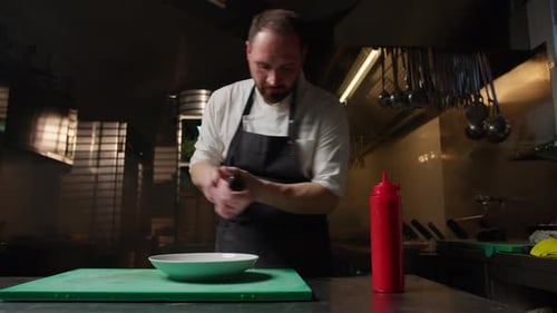 Chef Preparing Food in a Professional Kitchen