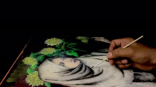 Artist Hand Painting Portrait with Flowers