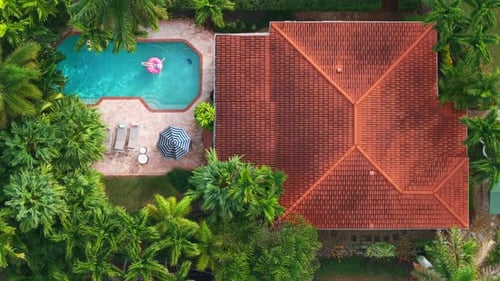 Luxury Vacation Concept of House with Stunning Pool and Backyard Oasis Aerial
