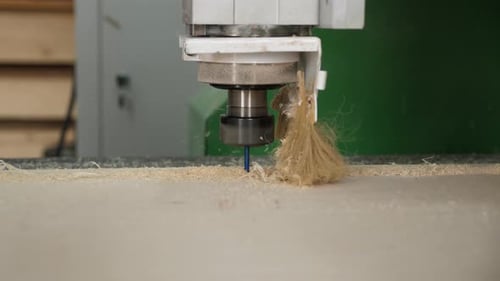 Automated Machine Drilling into Light Beige Surface
