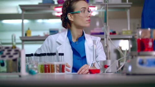 Woman Scientist Working in a Laboratory
