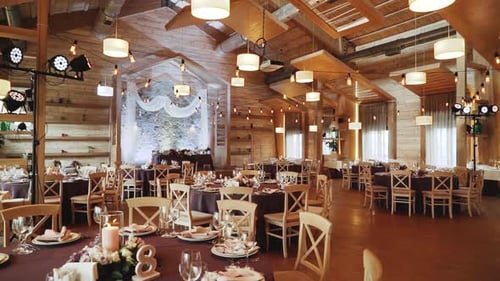 Wide Shot Wooden Banquet Hall with Decorations and Banquet Tables