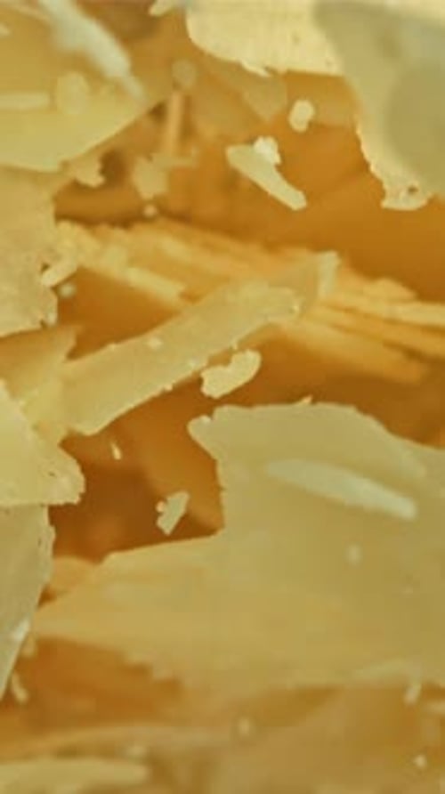 Parmesan Cheese Flies Up and Falls Down Filmed on a Highspeed Camera at 1000 Fps
