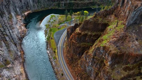 Rising over the narrow river floating through the mountainous area.