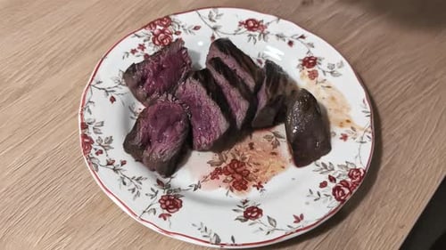 Medium-Rare Steak Slices on Plate