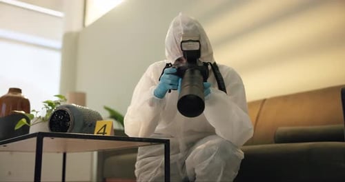 Forensic Investigator Photographs Evidence at Crime Scene