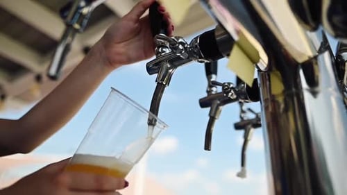 Bartender Pouring Beer In The Bar. Close-up