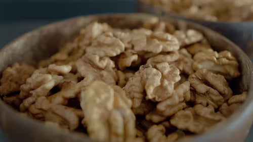 Delicious Walnut Halves in Wooden Bowl, Close Up