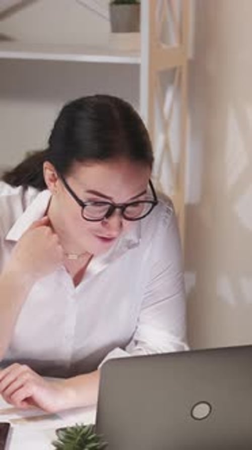 Young Adult in Video Conference at Modern Workplace