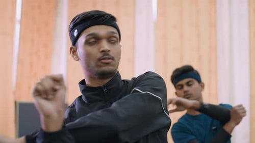 Close Up of Athletes Stretching During Indoor Exercise Session