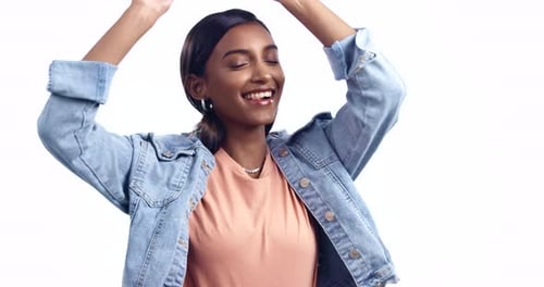 Happy, dance and face of Indian woman in celebration on white background in studio backdrop