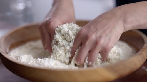 Mixing Kneading Flour Slow Motion 100 FPS in a stylish kitchen in a mixing bowl