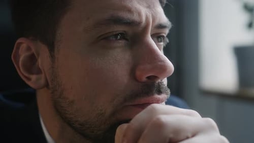 Pensive Businessman Thinking about Work in Office