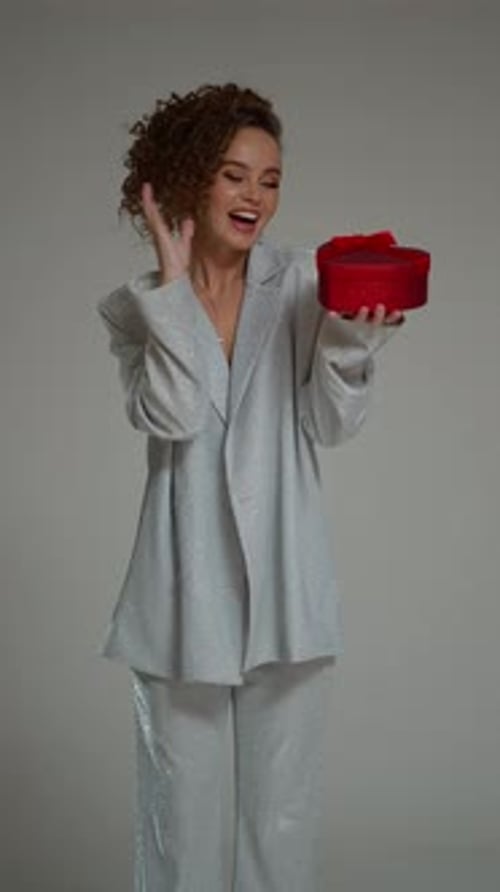 A Red Gift Box Magically Appears at a Woman