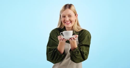 Smile, woman and barista giving coffee cup in studio isolated on a blue background mockup space