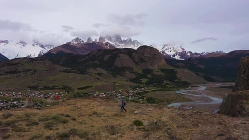 Man Looking at Mount Fitz Roy in Clouds