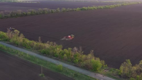 Working At The Field Tractor With The Seeder 22