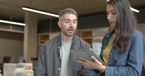 Business people casual meeting in office, discussing plans on Digital tablet