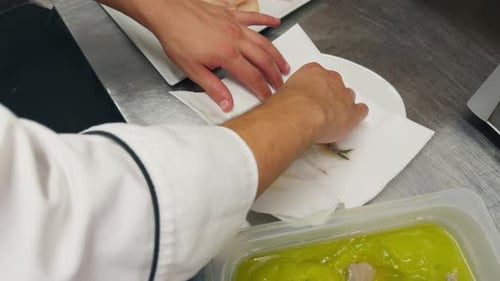 Preparation Of Second Course Food With Sliced Potatoes And Fish In Restaurant