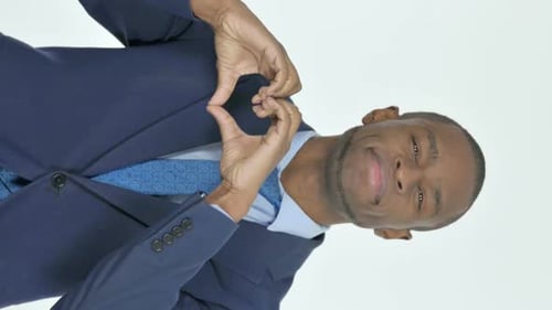 Smiling Man Making Heart Shape With Hands