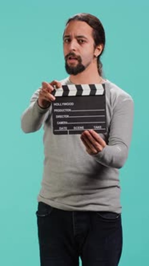 Vertical Video Movie Director Using Clapper on Set Filming Video Production
