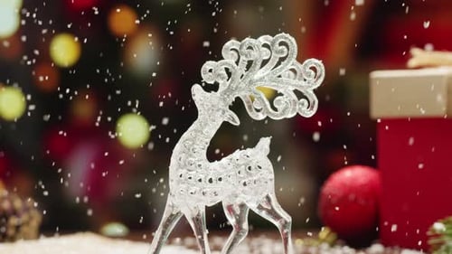 Festive Crystal Reindeer with Snow Falling