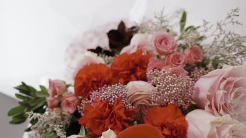 Elegant Flower Arrangement of Roses and Carnations