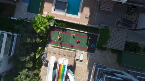 Aerial View Stunning Complex With Pool and Water Slides for Kids By the Sea
