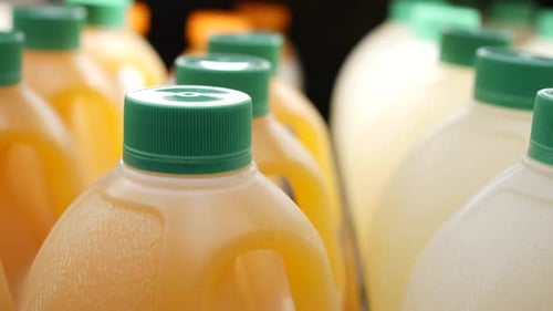 Orange Juice and Lemonade Bottles Close Up