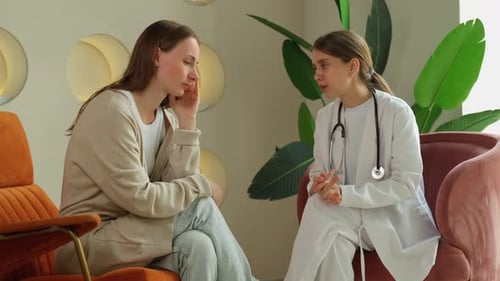 Doctor Consults With Patient in Modern Office