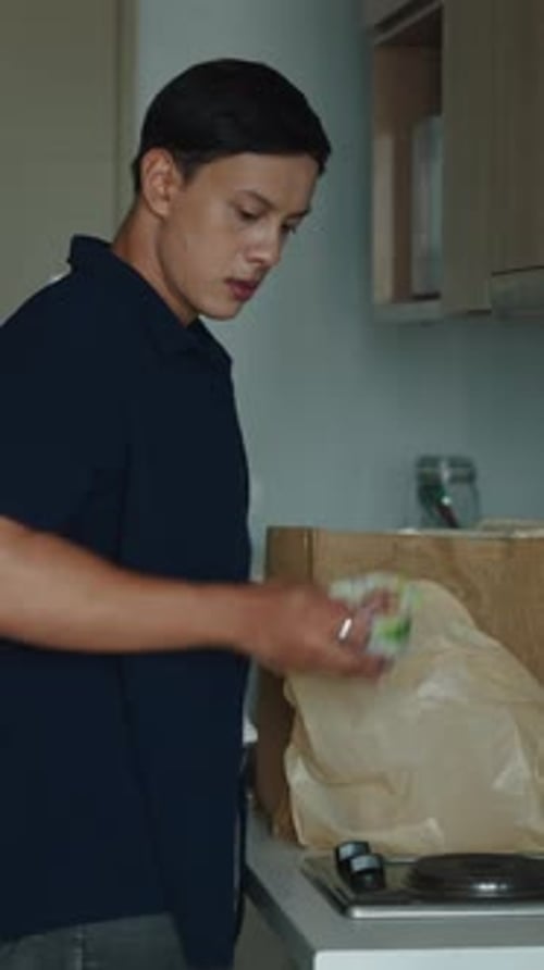 Man Unpacking Groceries in Kitchen, Healthy Food