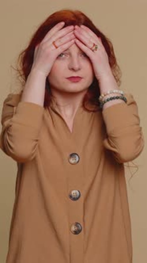 Woman Experiencing Pain and Discomfort, Holds Throat and Head