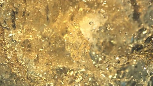 Juicy freshness explosion. Healthy natural juice splashing in extreme slow-motion. Dramatic close-up