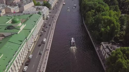 Saint-Petersburg, an aerial drone footage of a boat in a river, channel, Church of Savior on Blood,