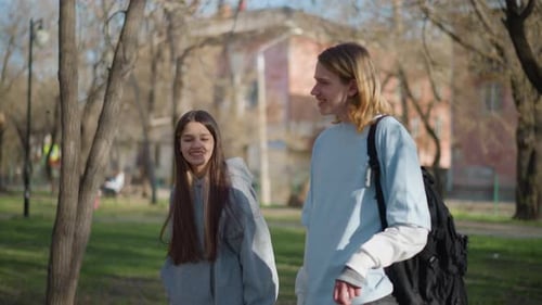 Two Companions Laugh Along Nature Trail Nearby Two Friends of Caucasian Background Engage in Joyful