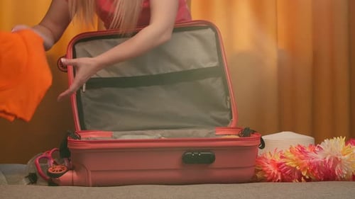 Woman Packing Suitcase for Summer Vacation