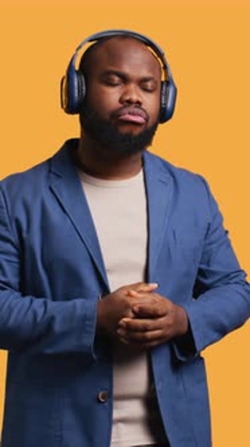 Vertical Video Man Enjoying Songs and Singing Lyrics Isolated Over Studio Background