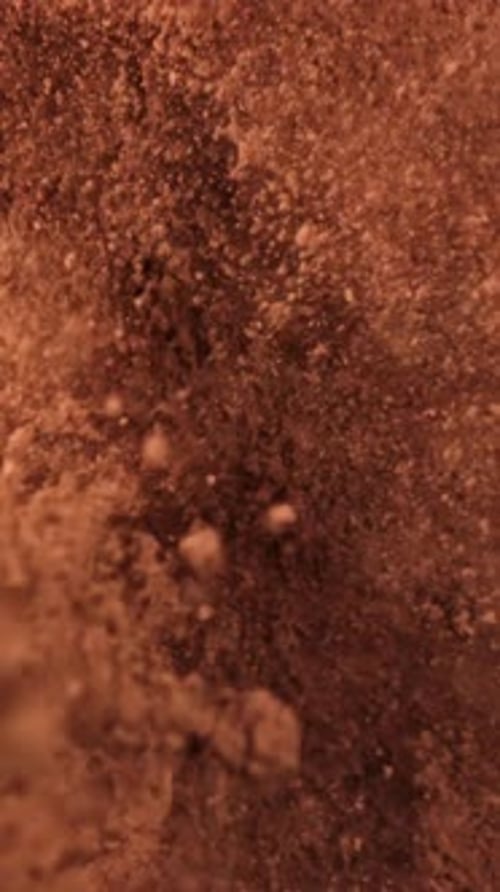 Cocoa Powder Falls on the Table Filmed on a Highspeed Camera at 1000 Fps