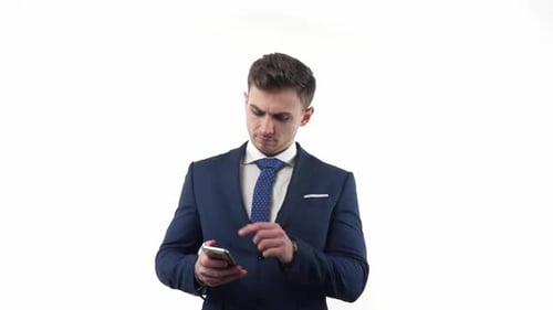 Man in Suit Using Cell Phone Device