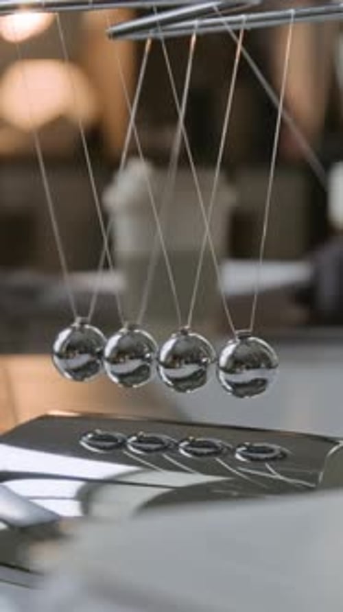 Kinetic Balls Pendulum Moving Back and Forth Abstract