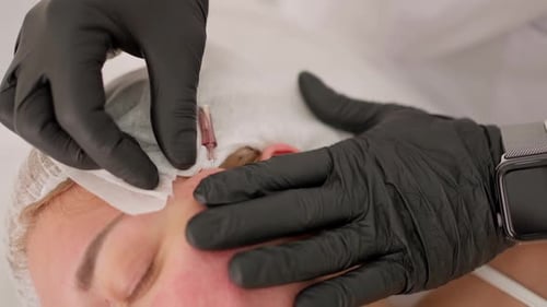 Receiving Forehead Treatment at a Medical Spa