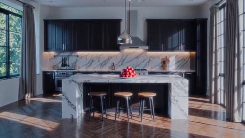 This is a Modern Kitchen Showcasing a Beautiful Marble Island and Ample Natural Light