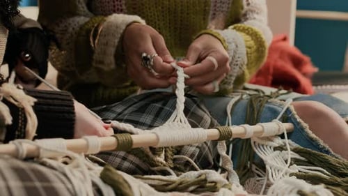 Two Unknown Young Women Weaving Interior Piece Using Macrame Technique