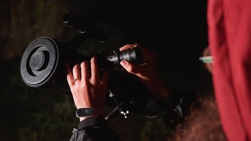 Woman Adjusting Telescope at Night for Space Exploration