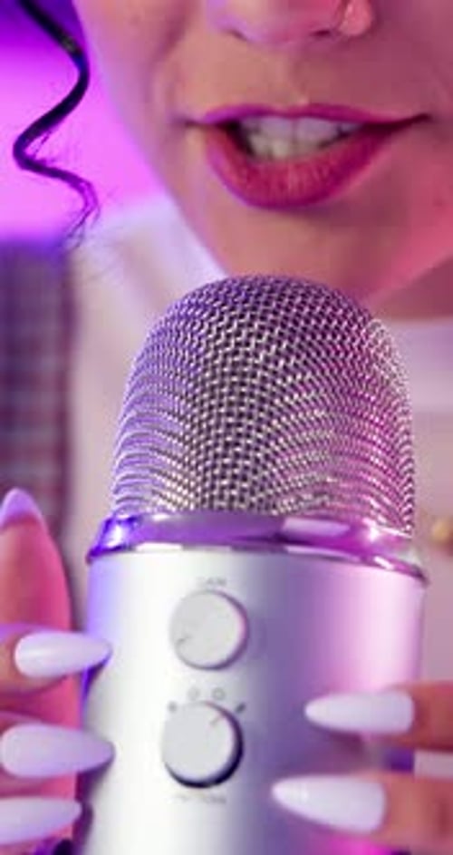 Girl hands, microphone and ASMR in studio for scratch, social media or influencer by neon lights