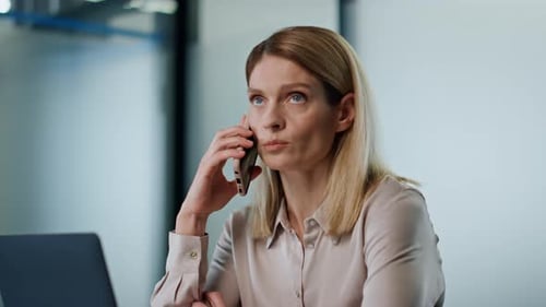 Confident Businesswoman Talking Cellphone In Office Interior. Closeup Female Ceo Calling Mobile P...