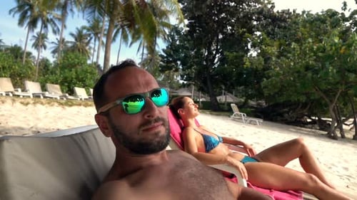 Happy Man Taking Selfie, Video on Sunbed on Beach, Super
