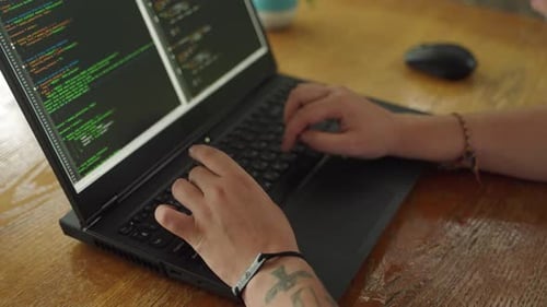 Tattooed Hands Type on Laptop Keyboard Coding Software Developer Programs App Debugs Code Tech