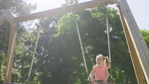 Cute Girl Climbing and Playing on the Playground