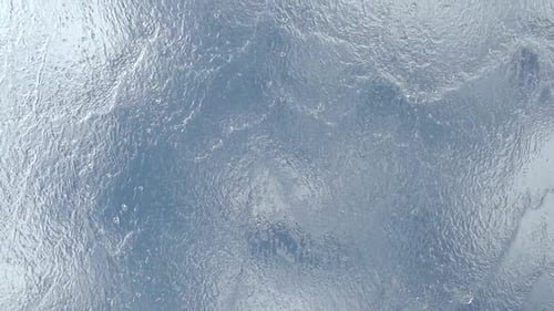 Aerial View of Sparkling Blue Water Surface